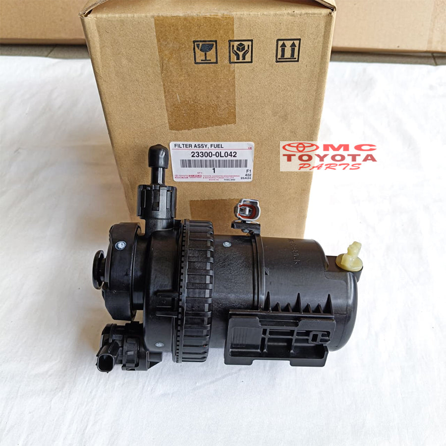 Rumah Filter Solar Assy Kijang Innova Fortuner Hilux Diesel 2KD Original Toyota 23300-0L042 Rumah Fuel Filter Solar Komplit Pompa Solar Assy Ori